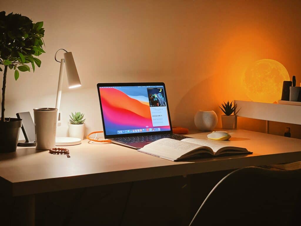 macbook pro on white wooden desk