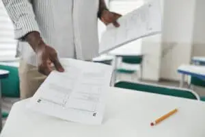 A Person Holding Test Papers